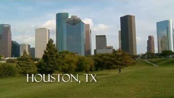 the houston tx skyline is seen in this image