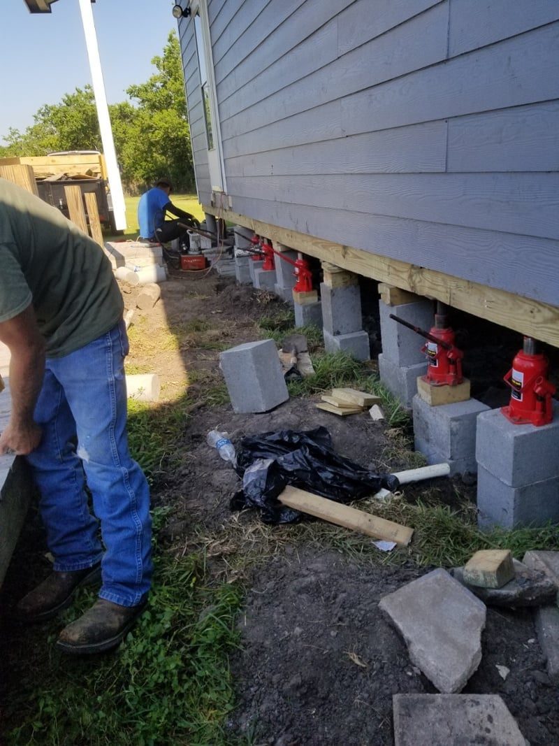 a man working on a house under construction