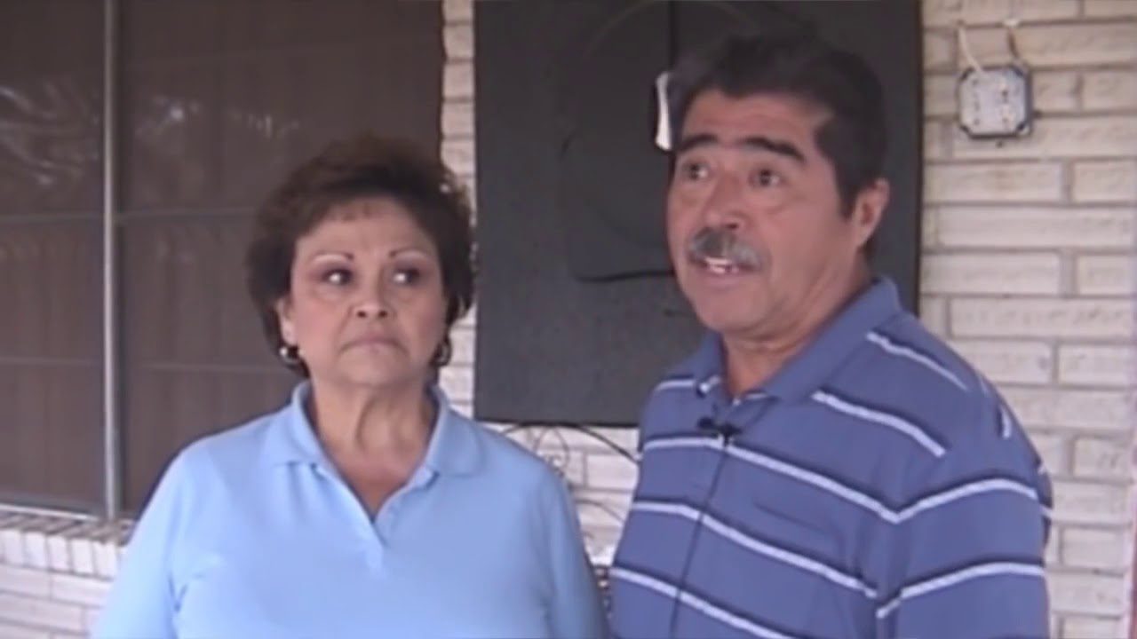 a man and woman standing next to each other