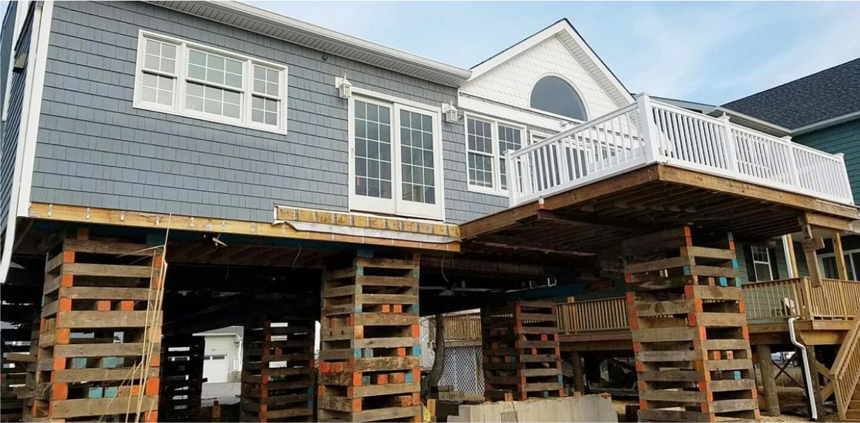 a house that is being built with wooden pallets