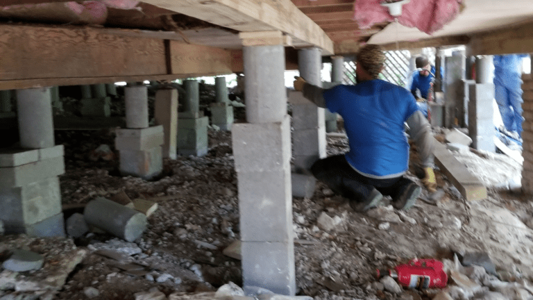 a man is working on a building under construction