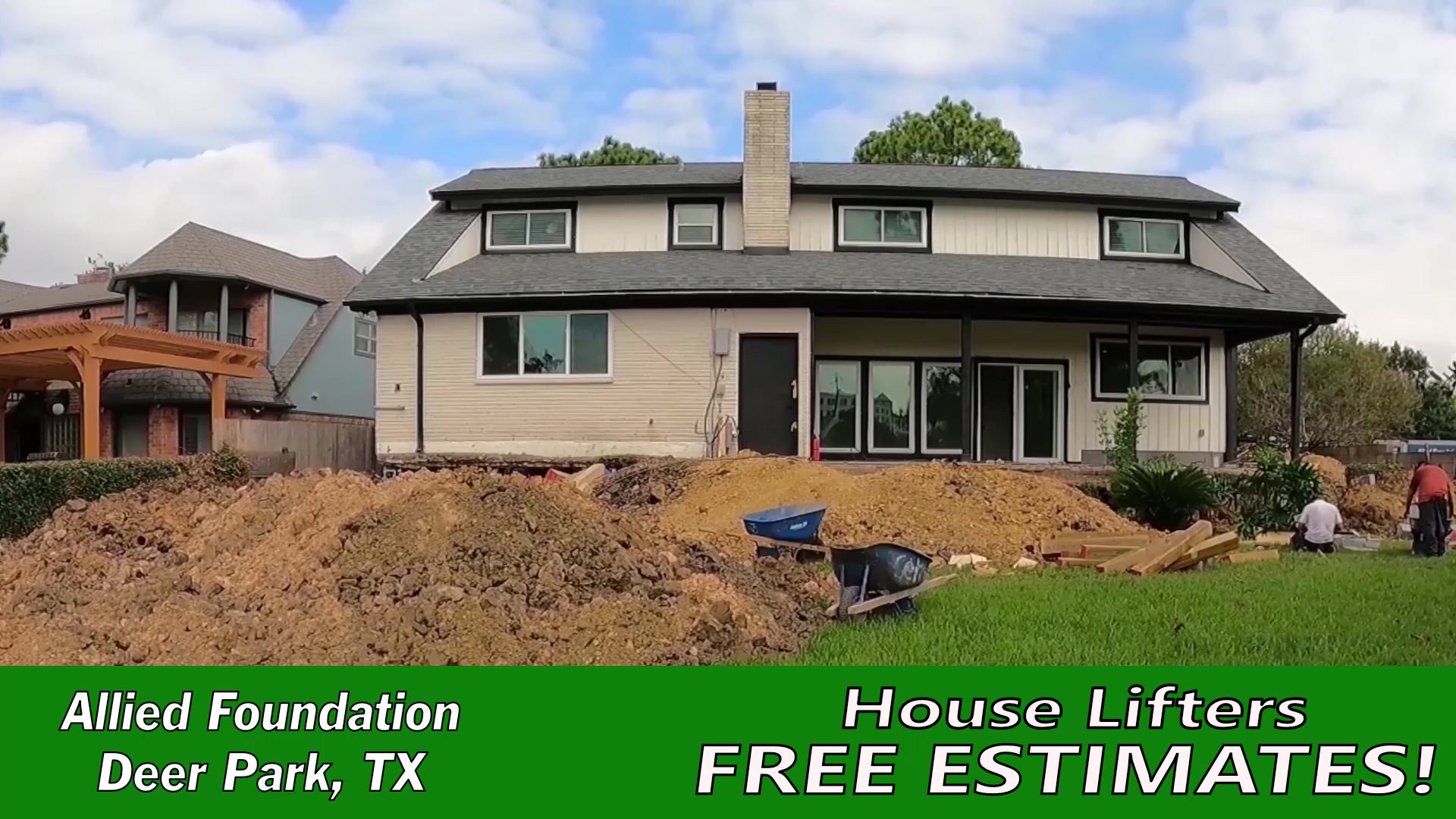 a large pile of dirt in front of a house
