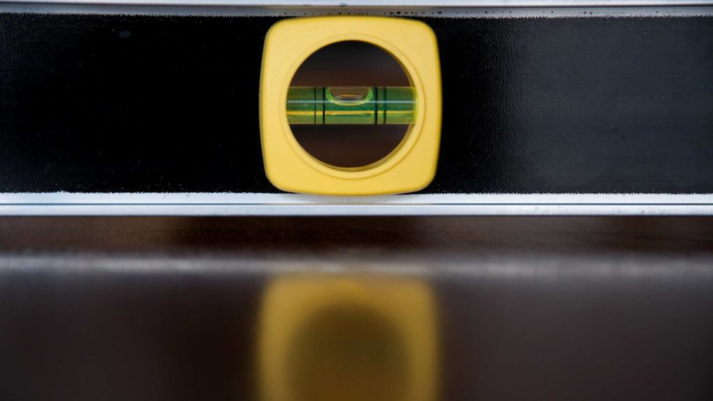a close up of a yellow object on a black surface
