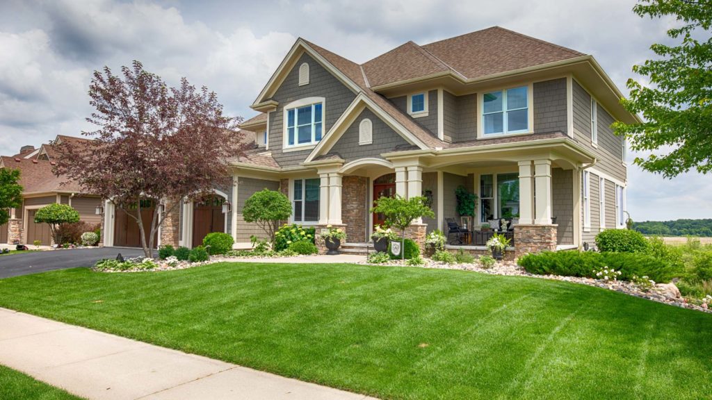 a large house with green grass in front of it