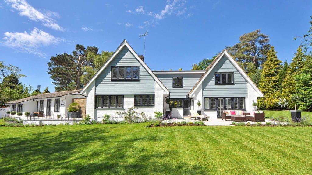 a large house with a lawn in front of it