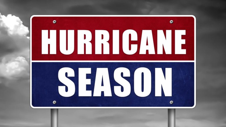 a red and blue sign that says hurricane season