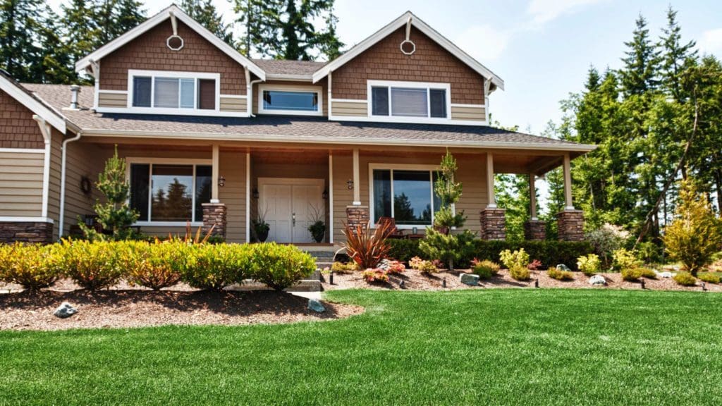 a house with landscaping in front of it