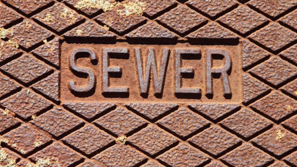 the word sever written in metal on a brick wall