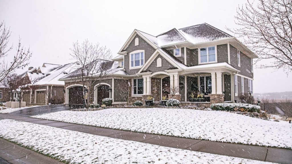 a large house with snow on the ground
