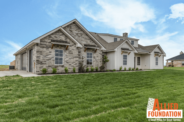 a house with a lot of grass in front of it